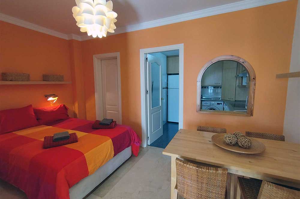 Estepona apartment dining area and bedroom